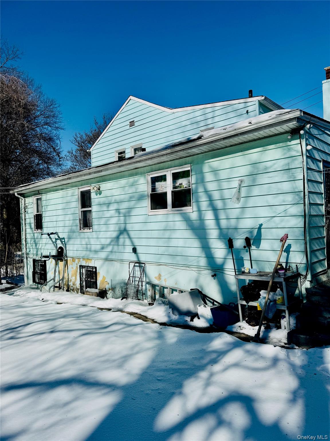 138 West Kingsbridge Road Mount Vernon, NY 10550 - Photo 6 of 6 a view of a house with a patio