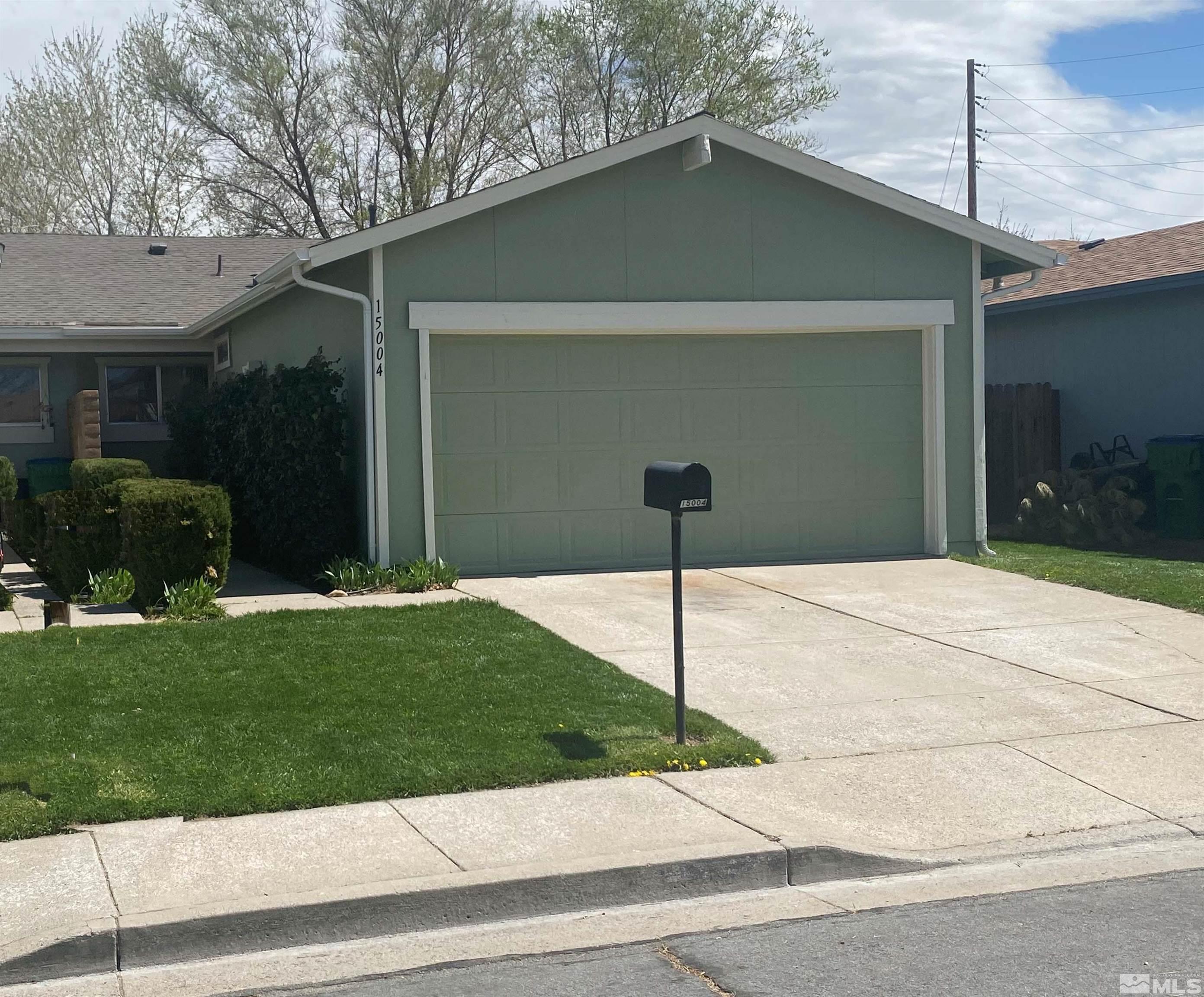 15004 Cuprite Street Reno, NV 89506 - Photo 1 of 22 a front view of a house with garden