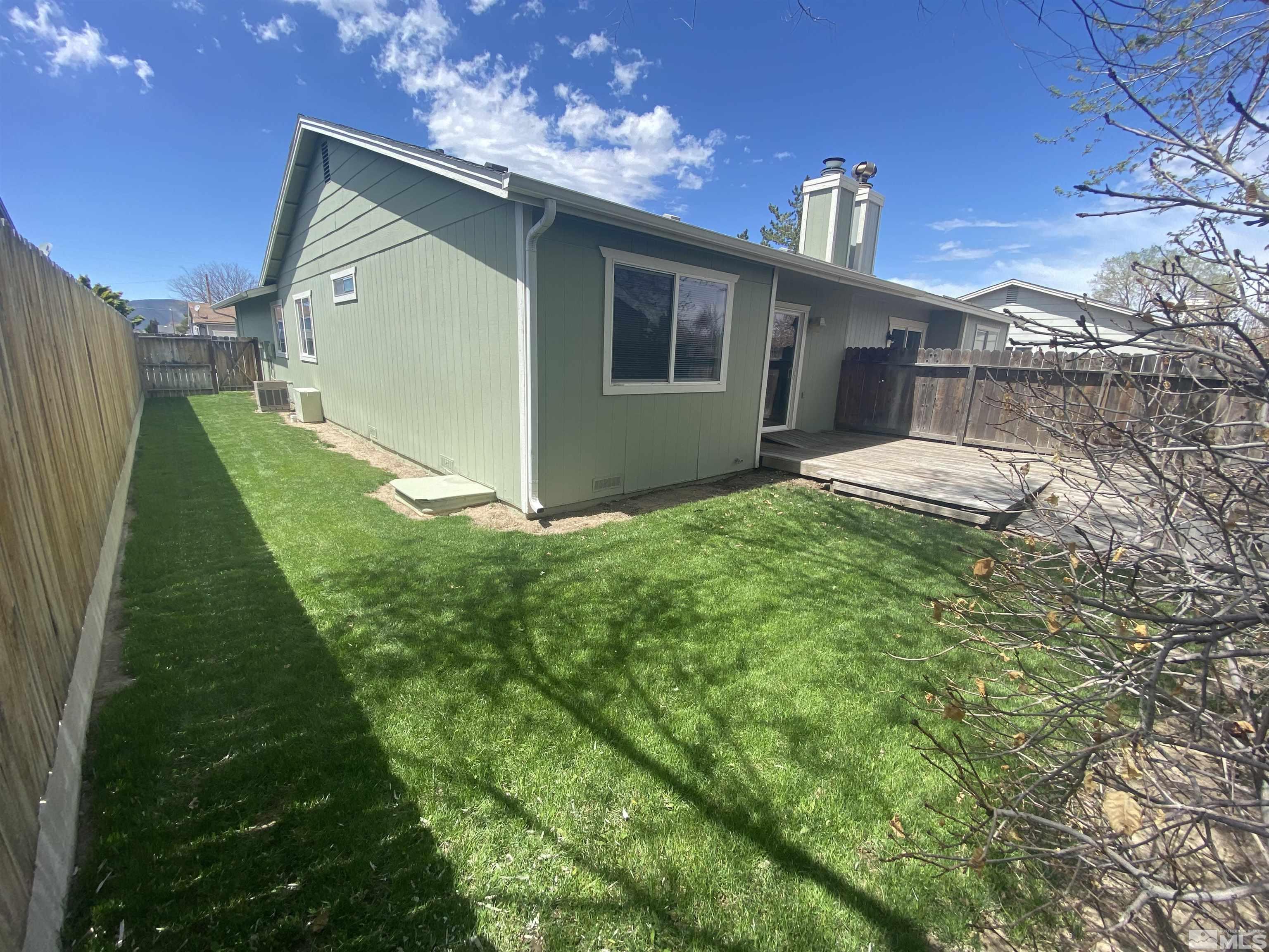 15004 Cuprite Street Reno, NV 89506 - Photo 12 of 22 a view of a house with a yard