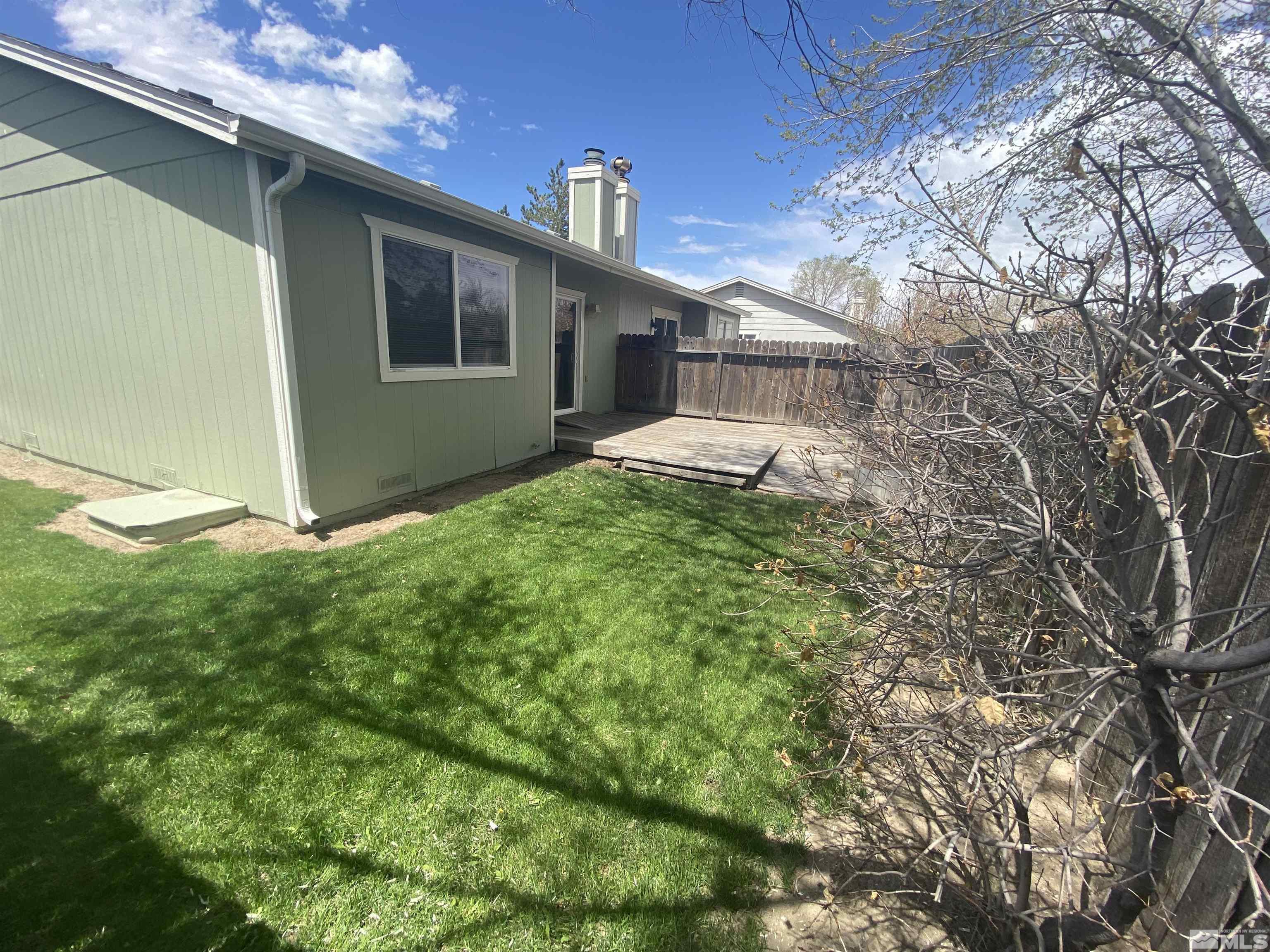 15004 Cuprite Street Reno, NV 89506 - Photo 13 of 22 a view of a house with a yard