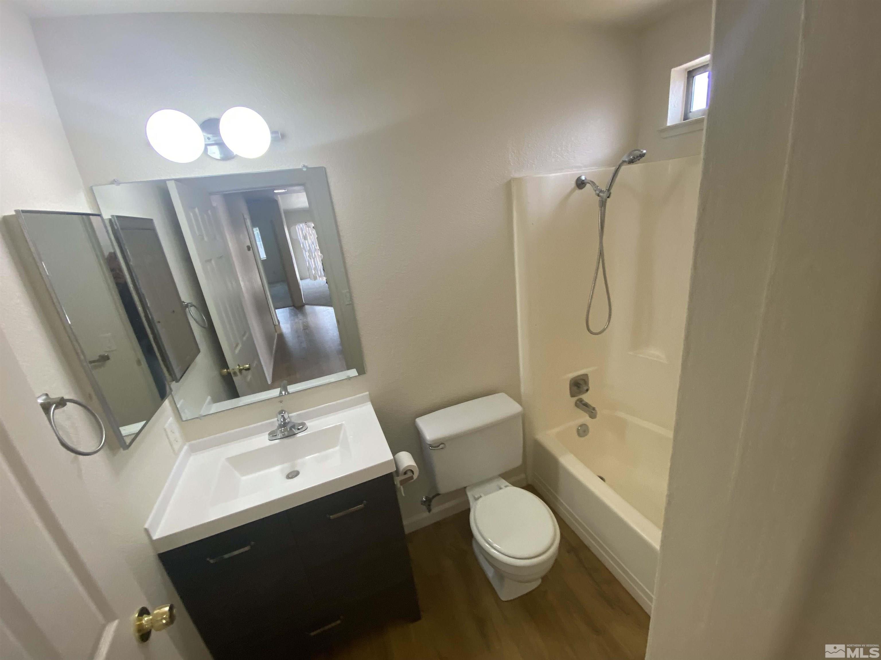 15004 Cuprite Street Reno, NV 89506 - Photo 15 of 22 a bathroom with a sink a toilet and shower