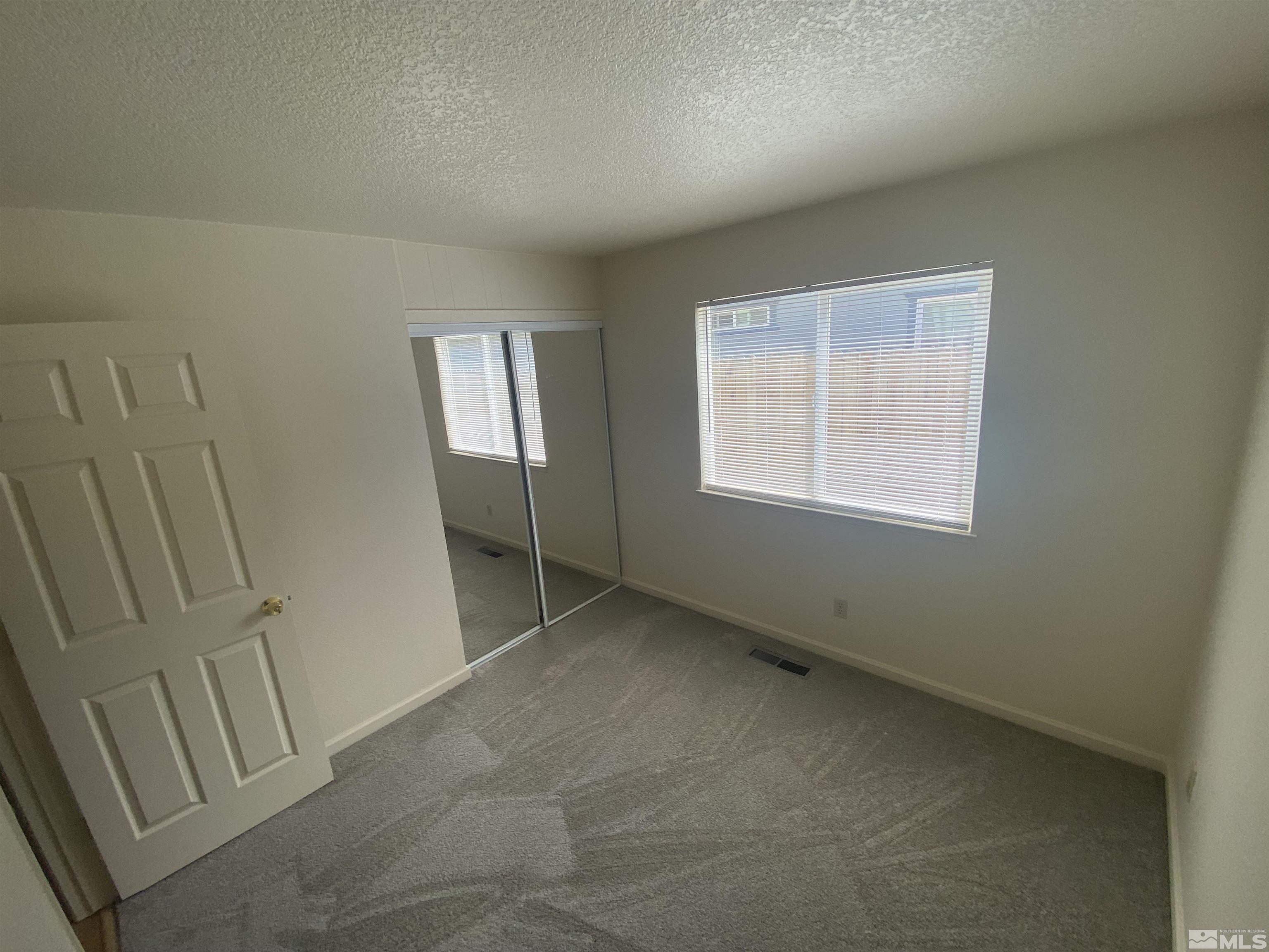 15004 Cuprite Street Reno, NV 89506 - Photo 16 of 22 an empty room with windows