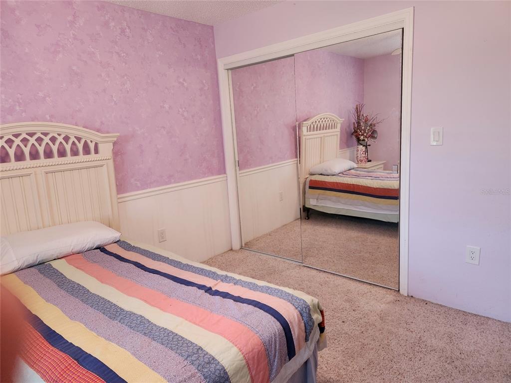 1137 Ponderosa Road Venice, FL 34293 - Photo 28 of 48 a bedroom with a bed and a window