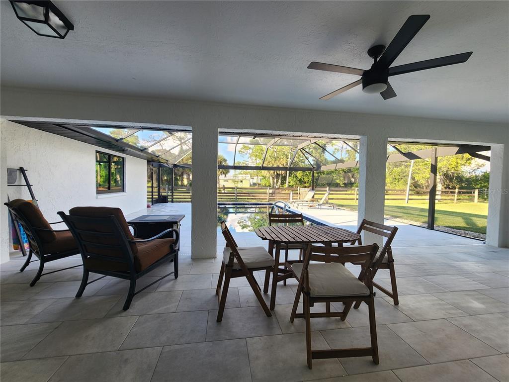 900 Crestwood Road Englewood, FL 34223 - Photo 11 of 38 a view of a dining room with furniture window and outside view