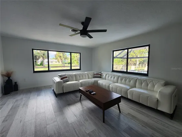 a living room with furniture and a window