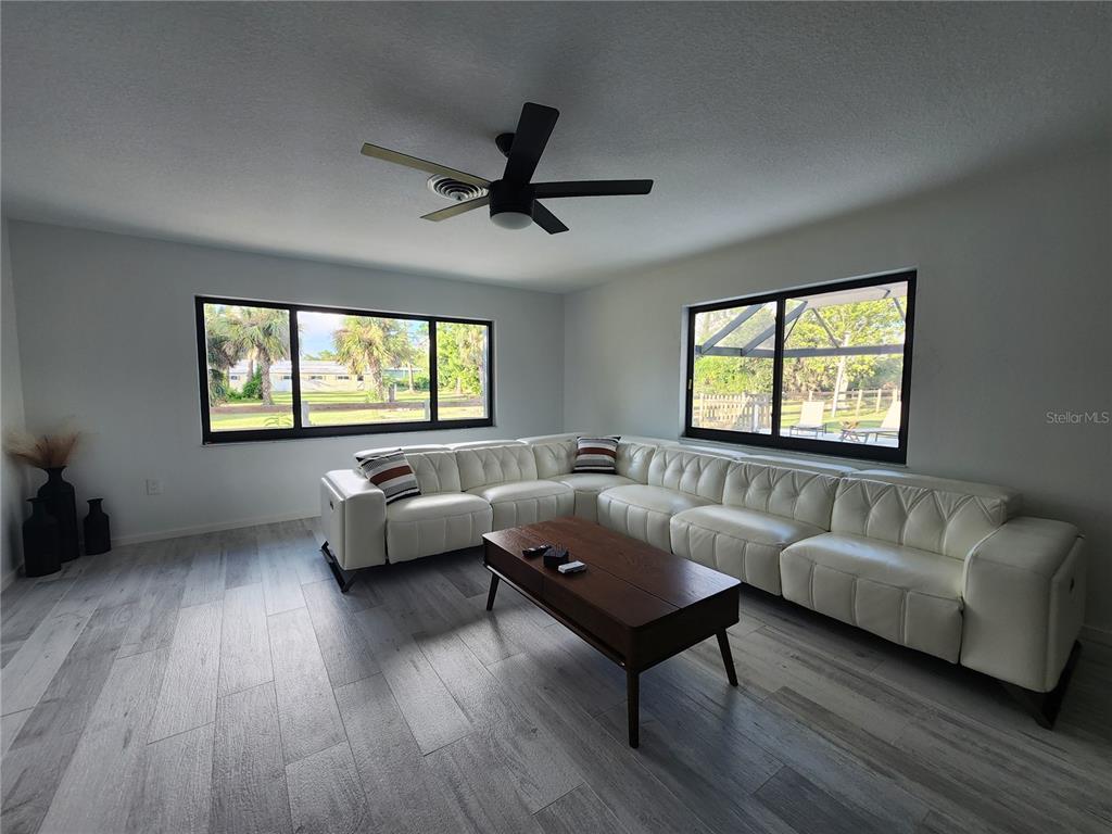900 Crestwood Road Englewood, FL 34223 - Photo 16 of 38 a living room with furniture and a window