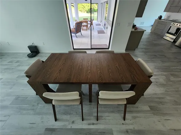 a balcony with table and chairs