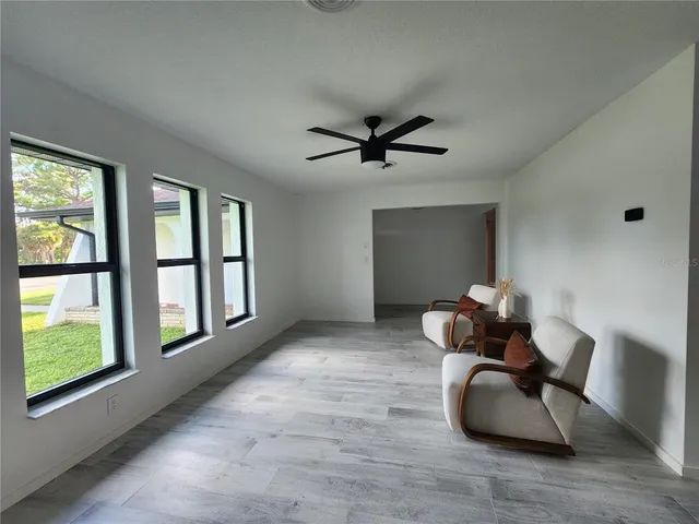 a room with furniture and a large window