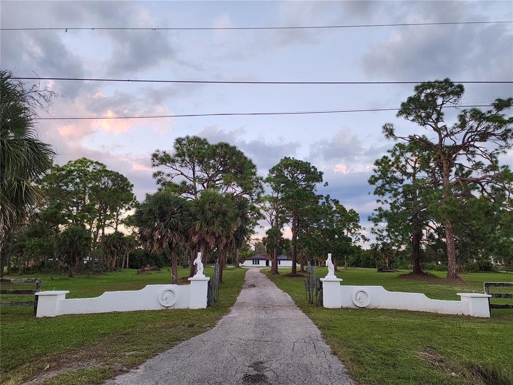 900 Crestwood Road Englewood, FL 34223 - Photo 23 of 38 a view of a garden