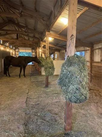 a view of a porch with table and chairs