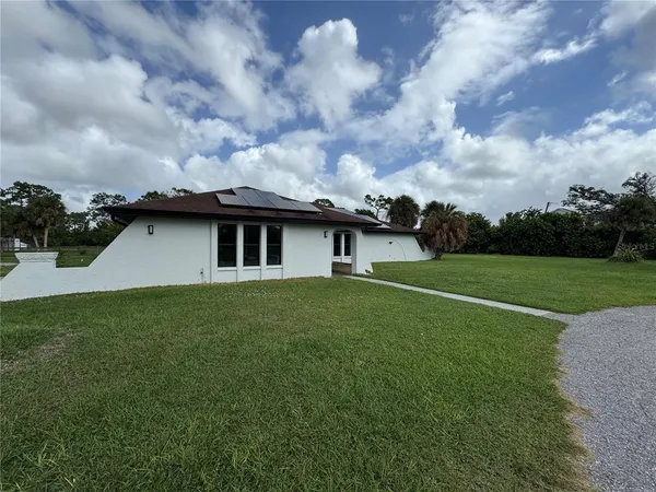a view of a yard in front of a house