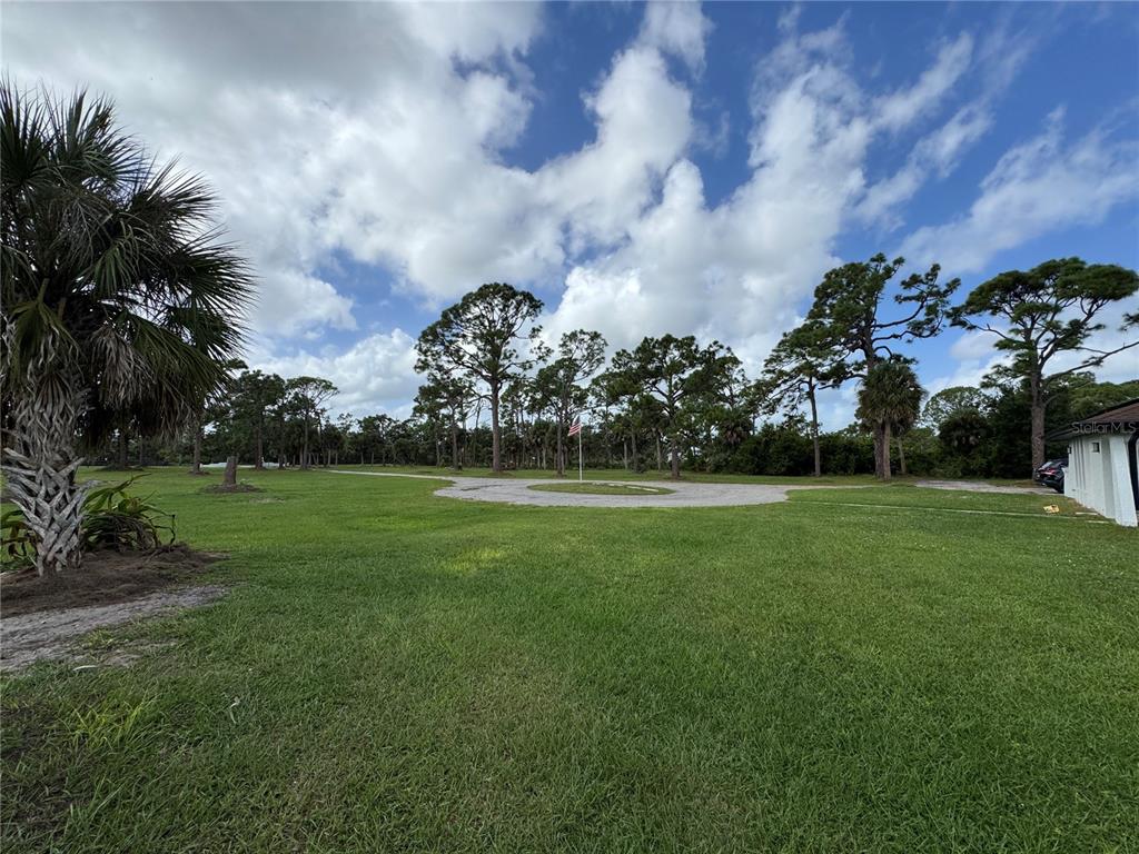900 Crestwood Road Englewood, FL 34223 - Photo 37 of 38 a view of building with outdoor space