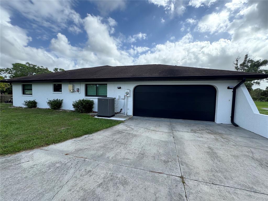 900 Crestwood Road Englewood, FL 34223 - Photo 38 of 38 a house view with a garden space