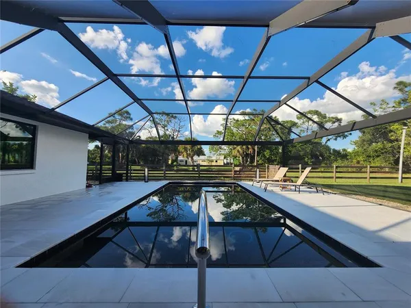 a view of a swimming pool with a patio