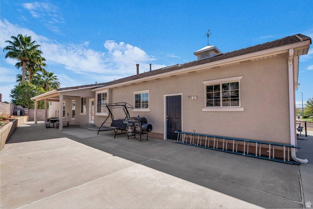 841 1010 S Street St. George, UT 84790 - Photo 31 of 33 Back of house featuring stucco siding and a patio area