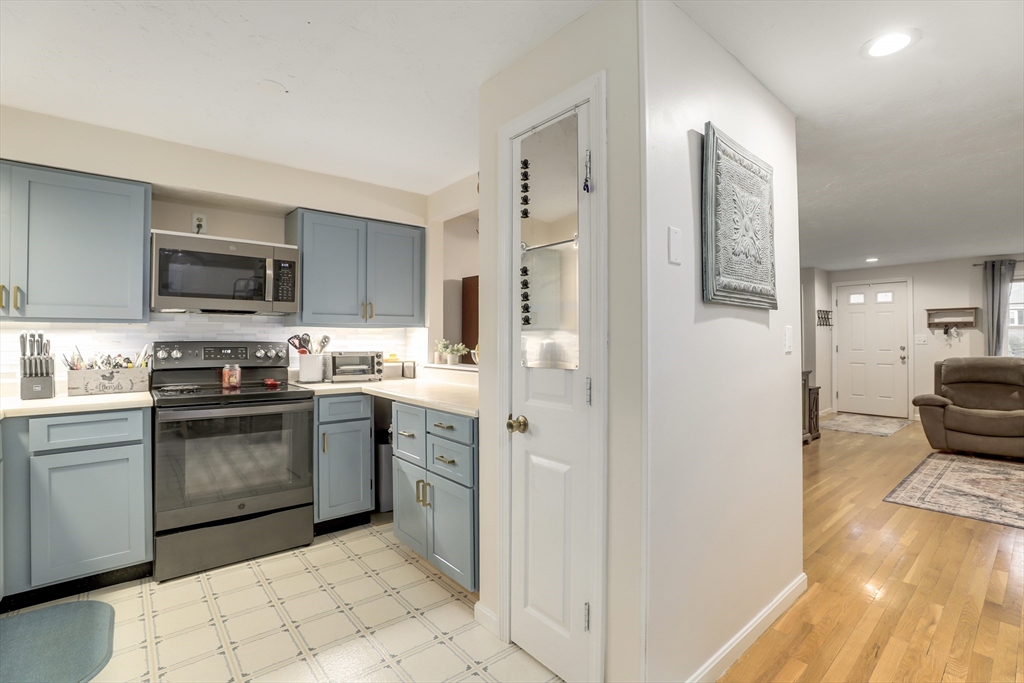 585 Turnpike Street, Unit 2 Easton, MA 02375 - Photo 8 of 25 a kitchen with stainless steel appliances granite countertop a stove top oven a sink and a refrigerator