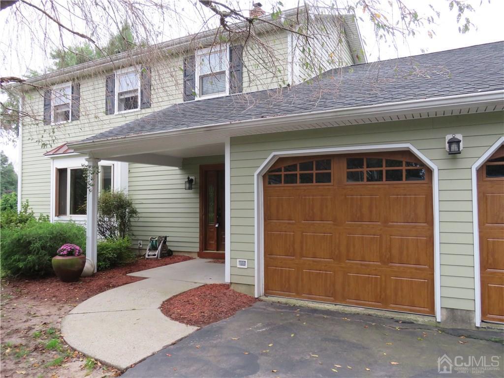 54 Fairfield Road Princeton, NJ 08540 - Photo 1 of 22 a front view of a house with a yard and garage