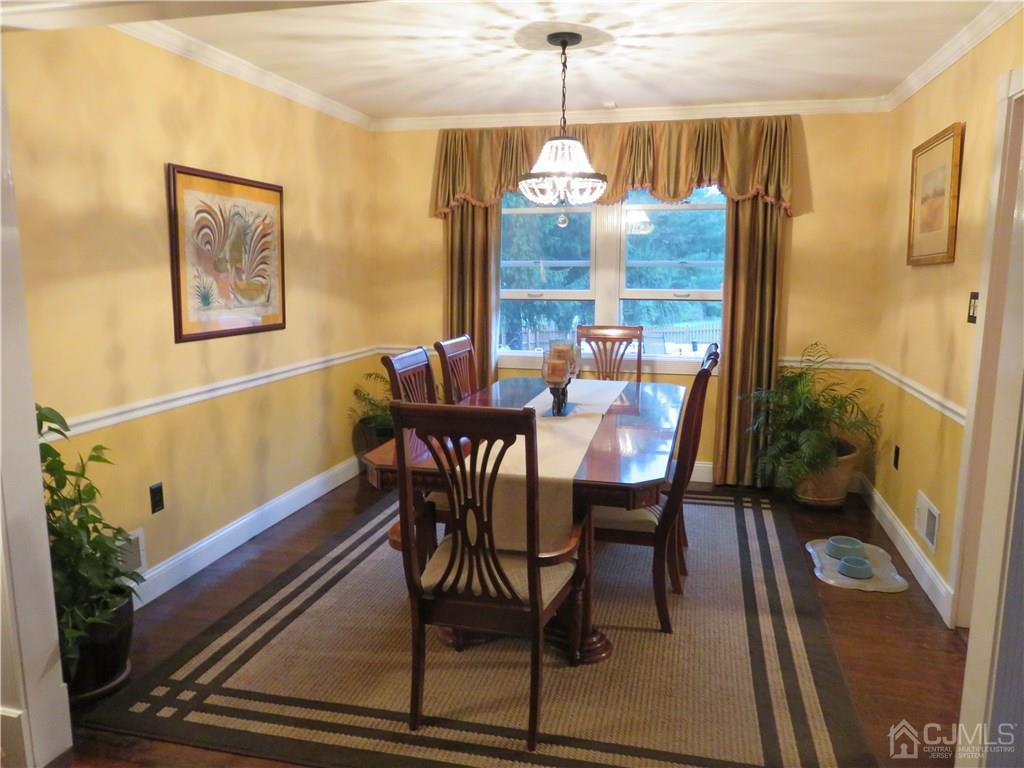 54 Fairfield Road Princeton, NJ 08540 - Photo 4 of 22 a dining room with furniture a chandelier and wooden floor