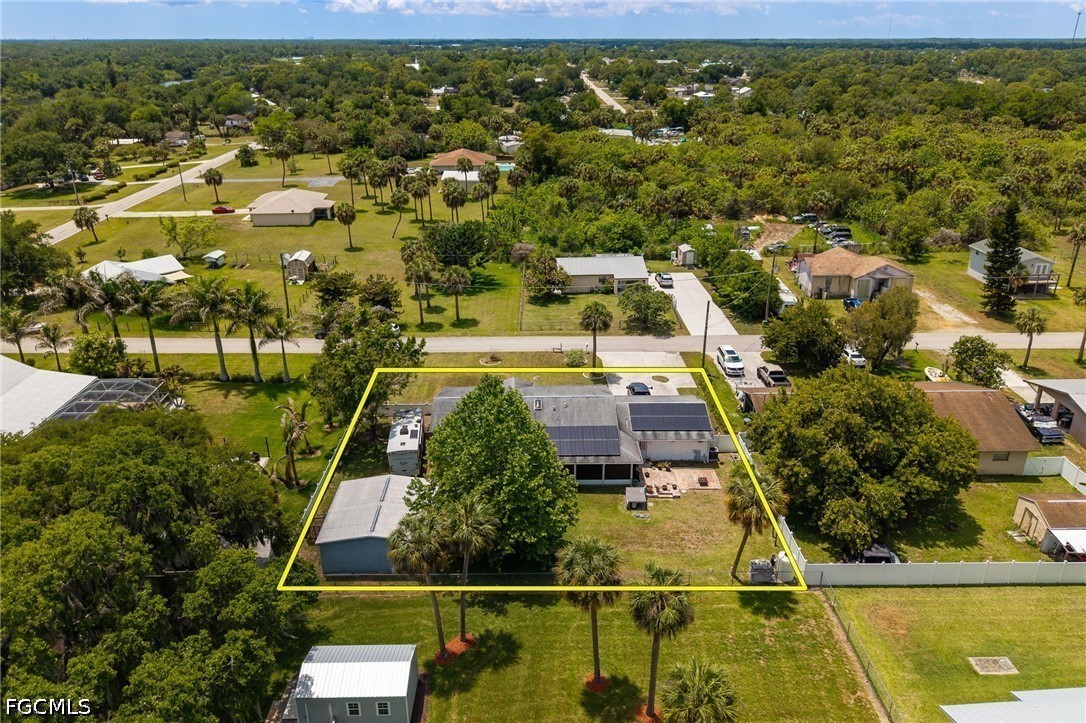 17290 Rewis Road Alva, FL 33920 - Photo 38 of 50 an aerial view of residential houses with outdoor space