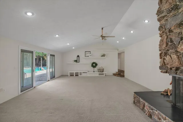 a view of a livingroom with furniture and a fireplace