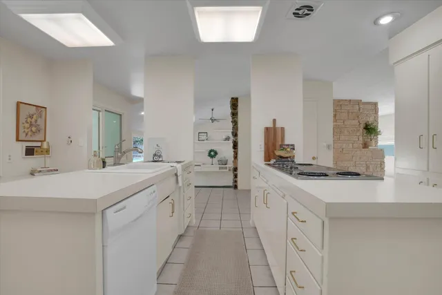 a large bathroom with a double vanity sink a mirror and a shower