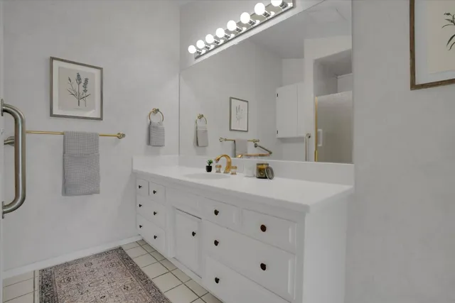 a bathroom with a sink and a mirror