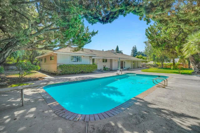 a view of a house with swimming pool