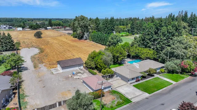 an aerial view of a house with a lake view