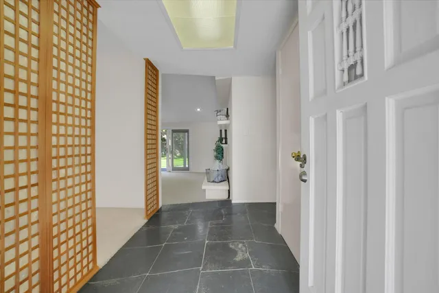 a bathroom with a glass door shower