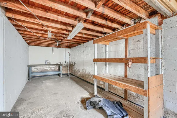 a view of an empty room with racks on the wall
