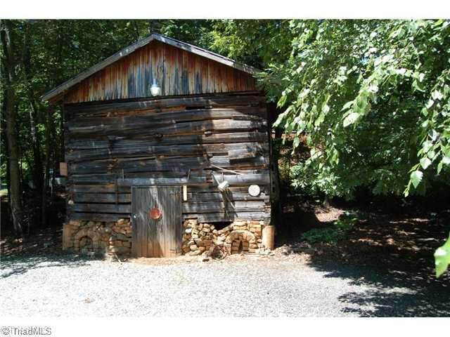 7600 Wallingford Road Greensboro, NC 27409 - Photo 3 of 14 Outbuilding. This tobacco barn is wonderful place for storage and adds to the charm!