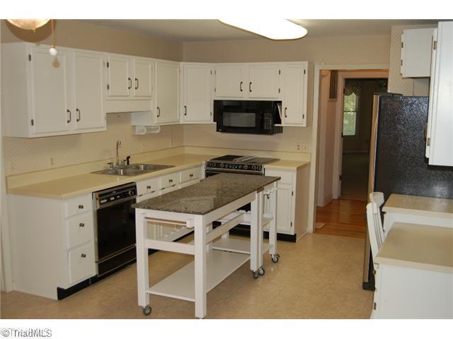 7600 Wallingford Road Greensboro, NC 27409 - Photo 7 of 14 Kitchen. THe huge kitchen includes nice pantry storage