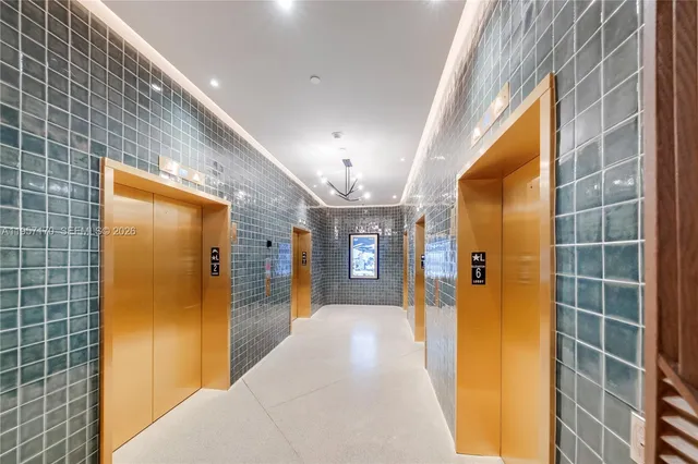 a view of a hallway with wooden shelves