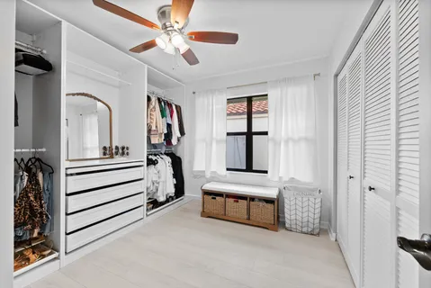 a bedroom with furniture and a window