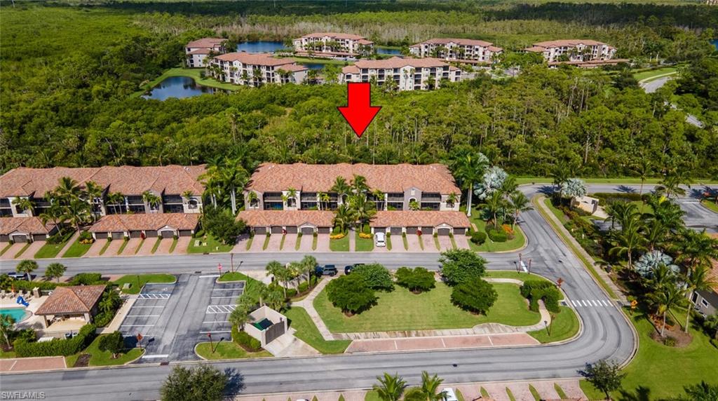 9828 Venezia Circle, Unit 1124 Naples, FL 34113 - Photo 3 of 50 an aerial view of houses with outdoor space
