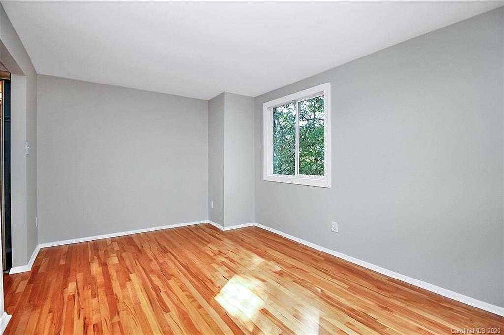 1231 Scaleybark Road, Unit C Charlotte, NC 28209 - Photo 17 of 36 a view of a room with a wooden floor