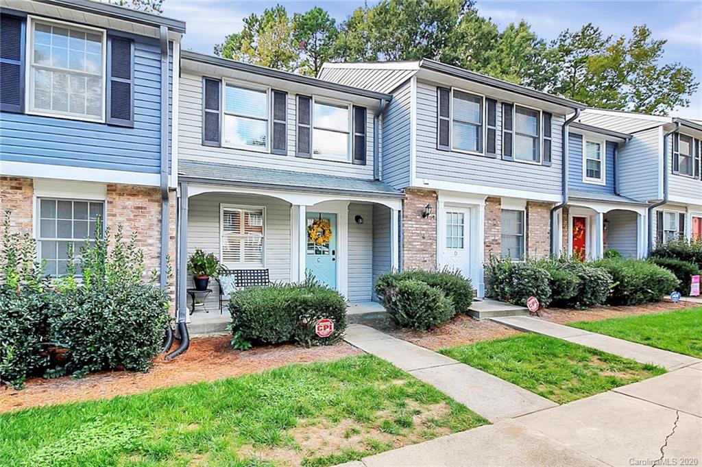 1231 Scaleybark Road, Unit C Charlotte, NC 28209 - Photo 3 of 36 front view of a brick house with a yard