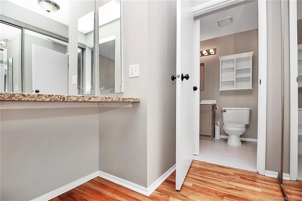 1231 Scaleybark Road, Unit C Charlotte, NC 28209 - Photo 21 of 36 a bathroom with a sink and a mirror