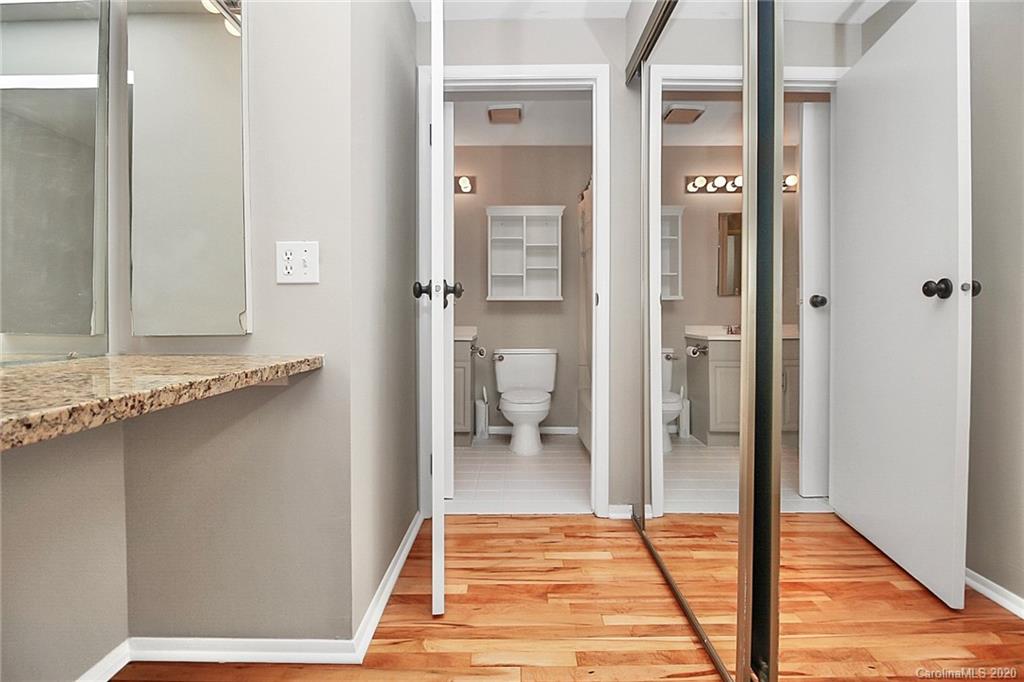 1231 Scaleybark Road, Unit C Charlotte, NC 28209 - Photo 22 of 36 a bathroom with a granite countertop shower and a sink