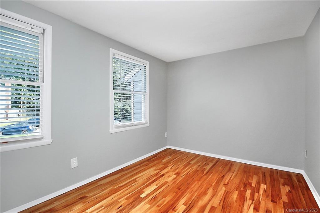 1231 Scaleybark Road, Unit C Charlotte, NC 28209 - Photo 24 of 36 a view of a room with wooden floor and fan