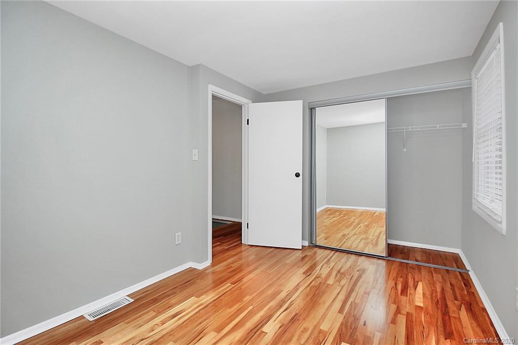 1231 Scaleybark Road, Unit C Charlotte, NC 28209 - Photo 26 of 36 a view of empty room with wooden floor and fan