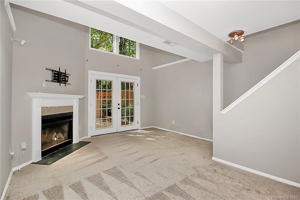 1231 Scaleybark Road, Unit C Charlotte, NC 28209 - Photo 27 of 36 a view of an empty room with a fireplace