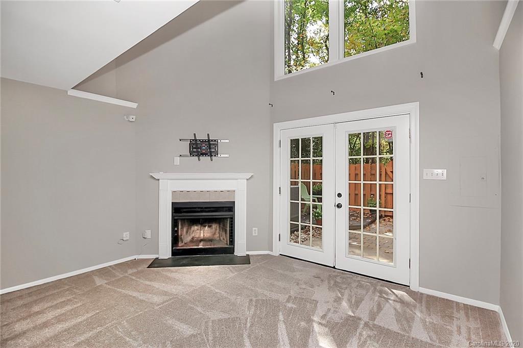 1231 Scaleybark Road, Unit C Charlotte, NC 28209 - Photo 28 of 36 a view of an empty room with a window and fireplace