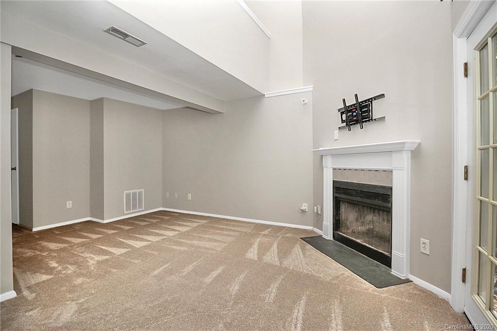 1231 Scaleybark Road, Unit C Charlotte, NC 28209 - Photo 30 of 36 a view of empty room with a fireplace