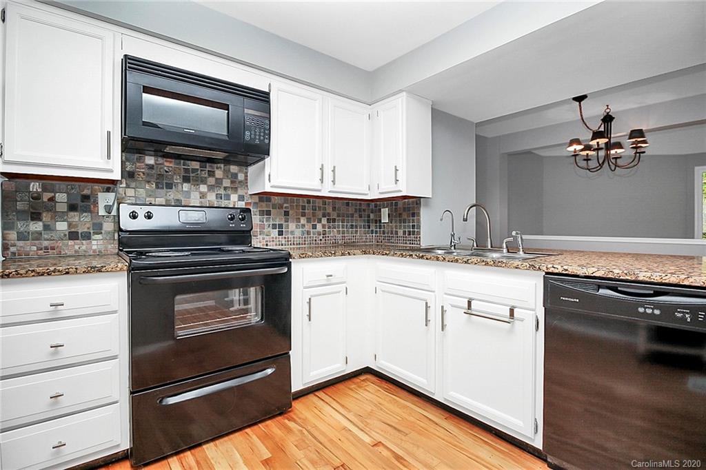 1231 Scaleybark Road, Unit C Charlotte, NC 28209 - Photo 9 of 36 a kitchen with a stove oven and sink