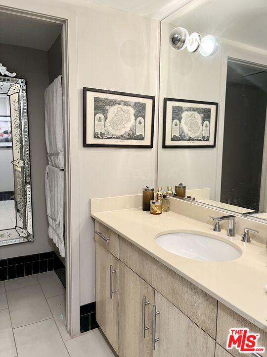 4111 Sunset Boulevard, Unit 332 Los Angeles, CA 90029 - Photo 11 of 17 a bathroom with a sink and a mirror