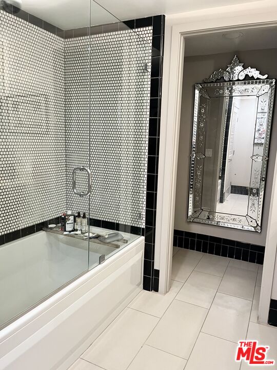 4111 Sunset Boulevard, Unit 332 Los Angeles, CA 90029 - Photo 12 of 17 a bathroom with a sink and a mirror