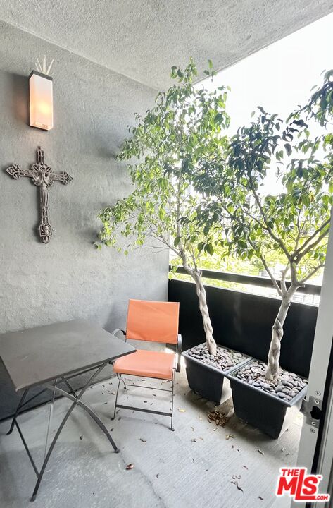 4111 Sunset Boulevard, Unit 332 Los Angeles, CA 90029 - Photo 17 of 17 a sitting area with furniture and wooden floor