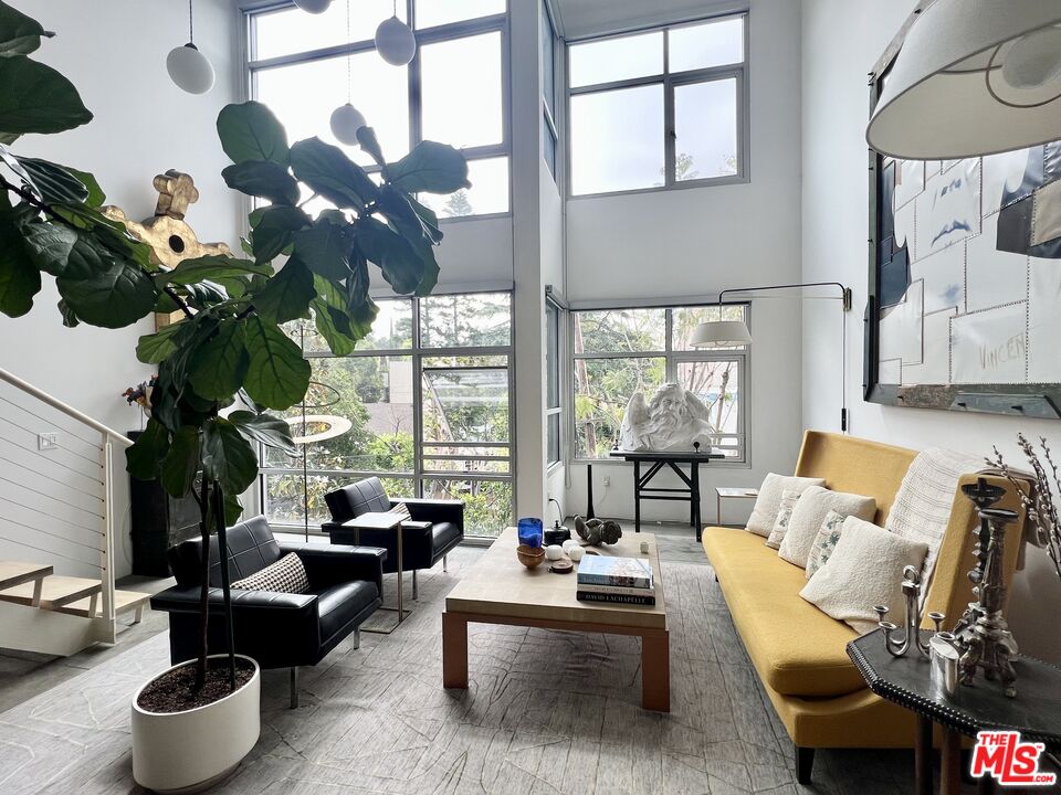 4111 Sunset Boulevard, Unit 332 Los Angeles, CA 90029 - Photo 2 of 17 a living room with furniture and a large window