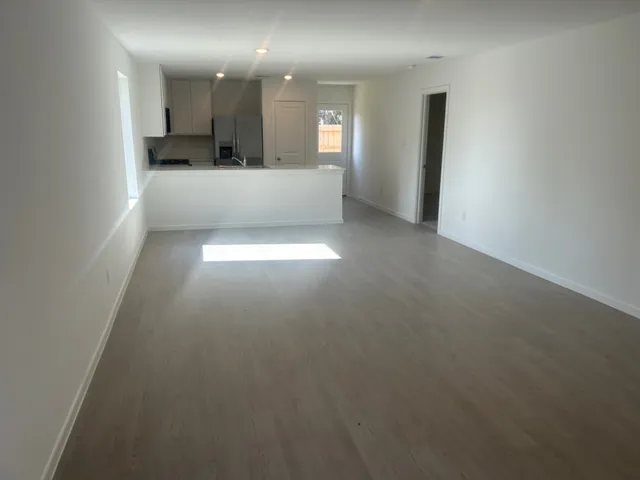 a view of a large kitchen with a sink